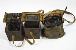 A WWII field telephone, and two field lights,