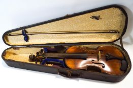 A 19th century violin with carved lions' head scroll, bears label for Henry Thompson,