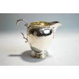 A silver cream jug, by Goldsmiths & Silvermiths Co Ltd, London 1927,