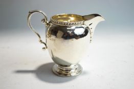 A silver cream jug, by Goldsmiths & Silvermiths Co Ltd, London 1927,
