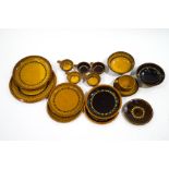 A collection of Dieter Kunzeman slipware pottery, in typical ochre and brown glazes,