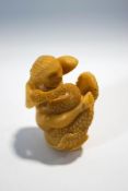 A carved tagua nut figure of Leda and the Swan,