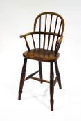 A 19th century child's Windsor elm chair,