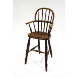 A 19th century child's Windsor elm chair,