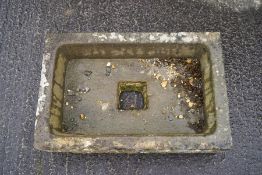 A rectangular stoneware sink,