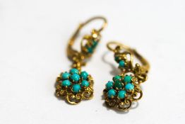 A pair of turquoise flowerhead cluster drop earrings,