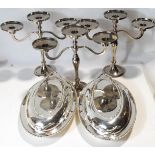 A trio of silver plated three light candelabra, 23.