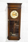 A Gustav Becker oak cased striking wall clock,