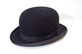 A bowler hat retailed by Harrods,