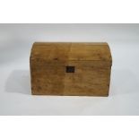 A pine blanket box with domed top and handles,