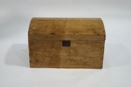 A pine blanket box with domed top and handles,