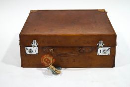 A leather gentleman's suitcase with First Class Cunard labels