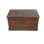 A pine blanket box with two handles and simulated wood grain finish,