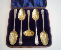 A cased set of silver berry spoons and sifting spoon, all with usual gilded later decoration,