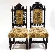 A near pair of 17th century style stained oak chairs, with barley twist supports,