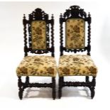 A near pair of 17th century style stained oak chairs, with barley twist supports,