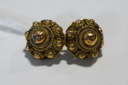 A brooch, formed by two cannetille style clusters, possibly previously earrings,