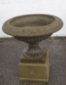 A pair of large re-constituted stone garden urns,