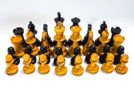 A Staunton pattern wooden chess set and box, King 7.