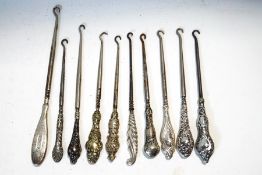 A collection of ten button hooks,