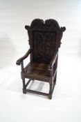 A Jacobean style stained oak throne chair,