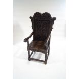 A Jacobean style stained oak throne chair,