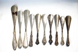 A collection of ten shoe horns,