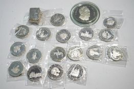 A quantity of commemorative silver coins and plaques,