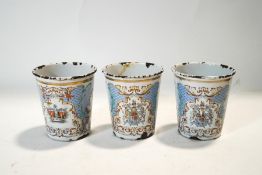 A set of three Victorian enamel beakers,