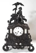 A French bronze rococo style mantel clock, the two train movement striking on a bell,
