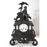 A French bronze rococo style mantel clock, the two train movement striking on a bell,