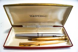 A Sheaffer fountain pen and two gilt metal pencils
