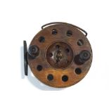 A wooden and brass 6" sea fishing reel