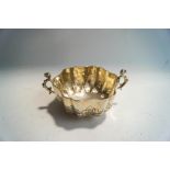 A late Victorian silver two handled sugar bowl in the Carolean style, by Frederick August Burridge,