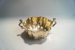 A late Victorian silver two handled sugar bowl in the Carolean style, by Frederick August Burridge,