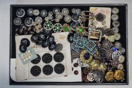 A collection of Victorian and later buttons including a buckle set with paste