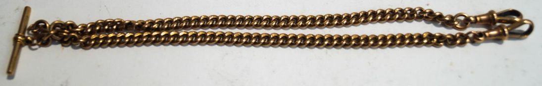 A 9ct gold watch Albert watch chain, of uniform solid curb links, with a T bar and two swivels,
