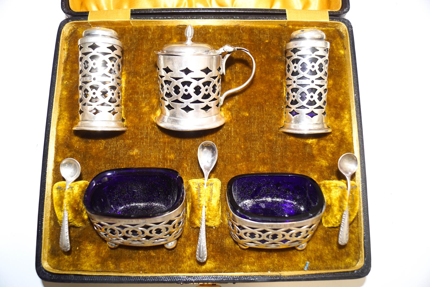 A late Victorian five piece silver condiment set, maker T.W.