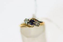 A 9 carat gold three stone sapphire and illusion set single cut diamond ring, finger size M, 2.