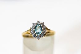 A 9 carat gold cubic zirconia and synthetic set cluster ring, finger size N1/2, 1.