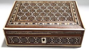 An Islamic rosewood box, inlaid with bone and white metal, with repeating geometric design,