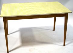 A retro kitchen table with yellow gingham top on square tapering beech legs, 75cm high x 121.