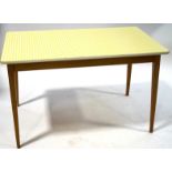 A retro kitchen table with yellow gingham top on square tapering beech legs, 75cm high x 121.