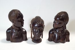 Three Nigerian carved tribal heads,
