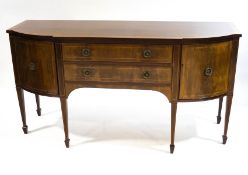 A Regency style mahogany bowfront sideboard, the two central drawers flanked by cupboards,