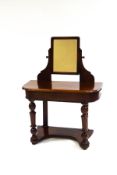 A Victorian mahogany dressing table with swing frame mirror and turned legs,