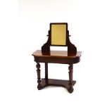 A Victorian mahogany dressing table with swing frame mirror and turned legs,