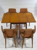 An Imperial 1960's dining table and a set of four chairs (sold as a collector's item only)