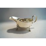 A silver sauce boat, Birmingham 1923, of usual cut rim form 15 cm long, 108g (3.