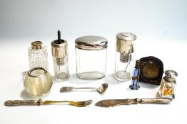 A glass match strike globe with silver rim; six dressing table bottles/scent atomisers,